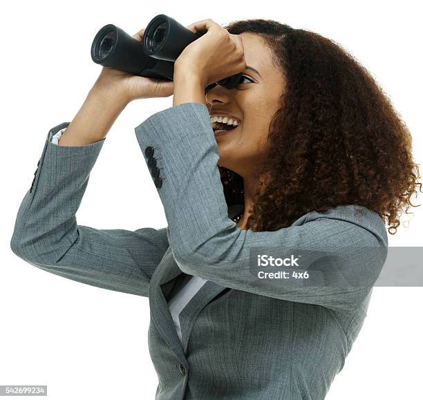 Cheerful Businesswoman Searching With Binoculars Stock Photo - Download Image Now - Binoculars, Businesswoman, 20-29 Years