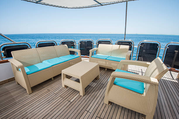 istock Table and chairs on deck of a luxury motor yacht 542699558