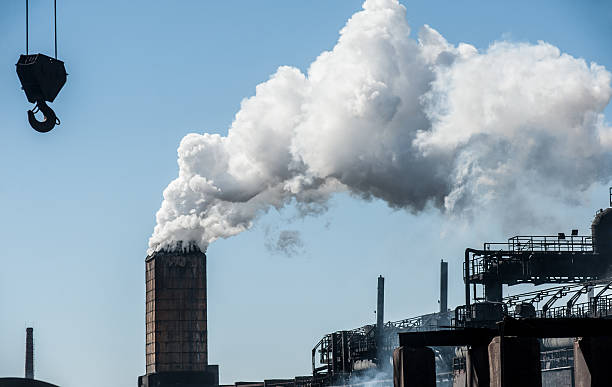 istock Smoke from a pipe factory polluting air, environmental problems 542701146