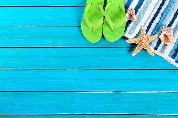 istock Summer beach background border, flip flops, starfish, copy space 542701150