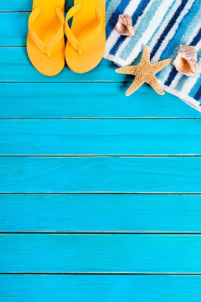 istock Summer beach background border, starfish, flipflops, blue wood 542701248