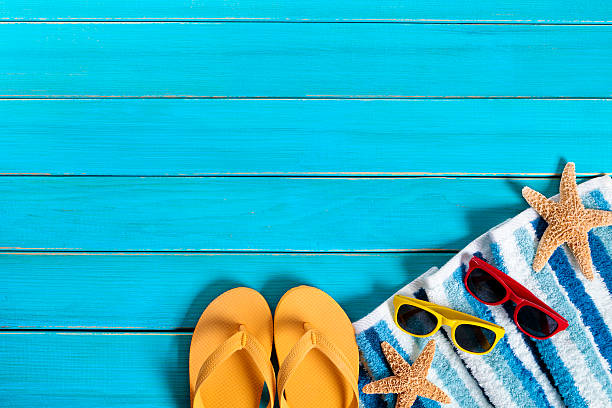 istock Summer beach background border, flip flops, starfish, copy space 542701612