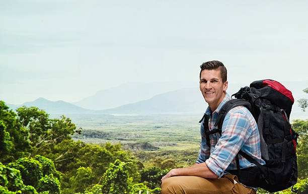 istock Smiling hiker sitting in mountain 542703964