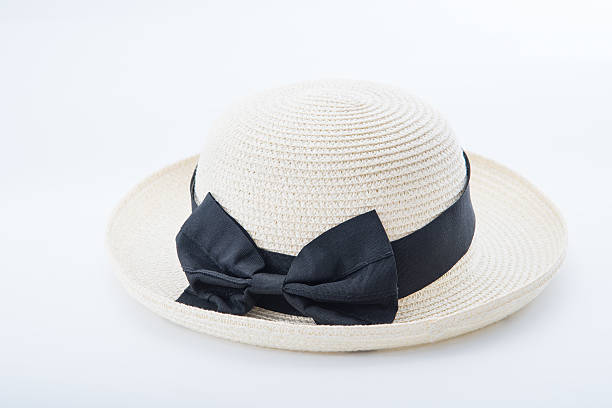 istock women hat on white background, straw and black ribbon. 542704064