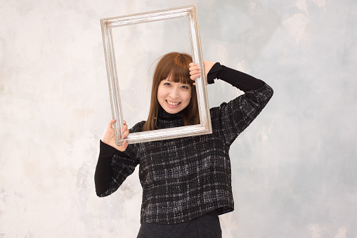 Portrait of Japanese woman have picture frame