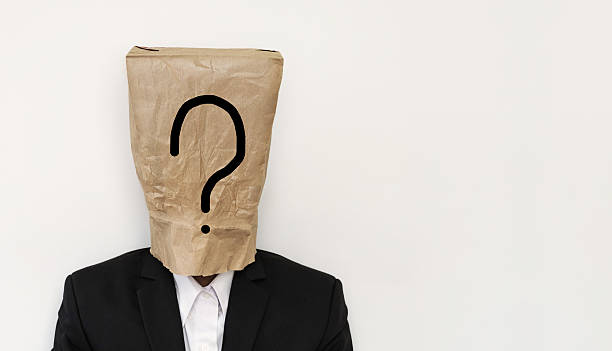 istock Businessman with brown paper bag on head, with question mark 542705612