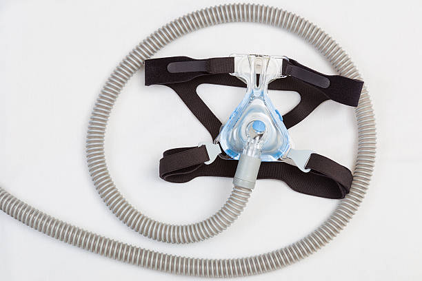 istock Sleep apnea headgear mask and hose 542705626