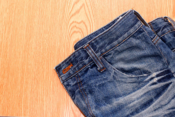 istock blue jean, blue denim on wooden,desk 13 542708972