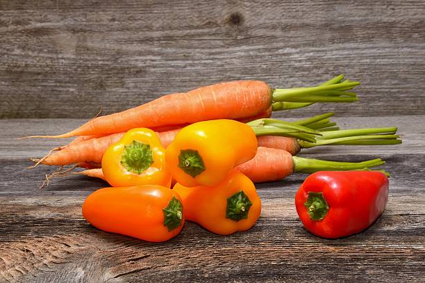 istock Vegetables on old wooden background 542709324