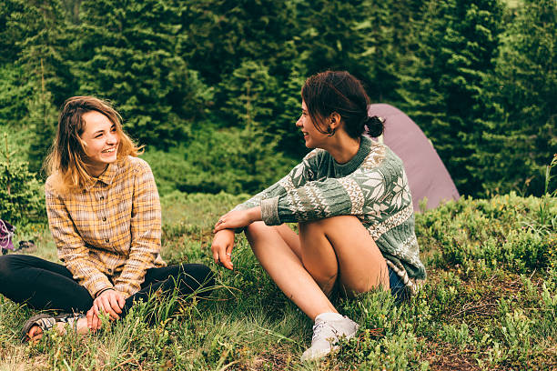 istock Two girls sitting in camping 542710320