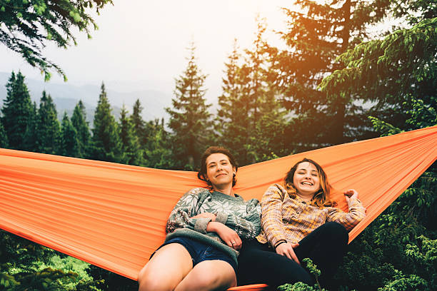 istock Two girl in hammock 542712456