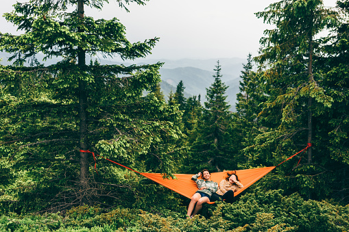 Two girls sitting in the hammock