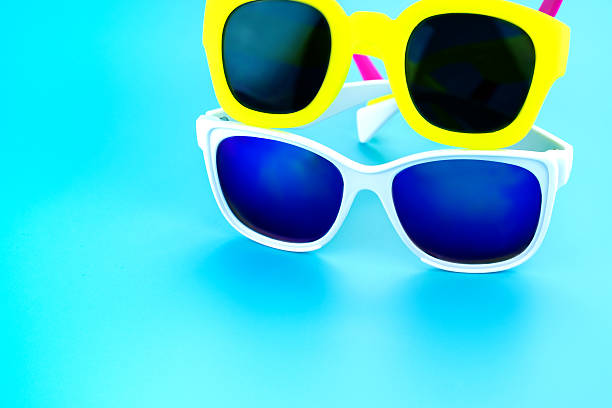 istock colorful sunglasses at light blue studio background 542714096