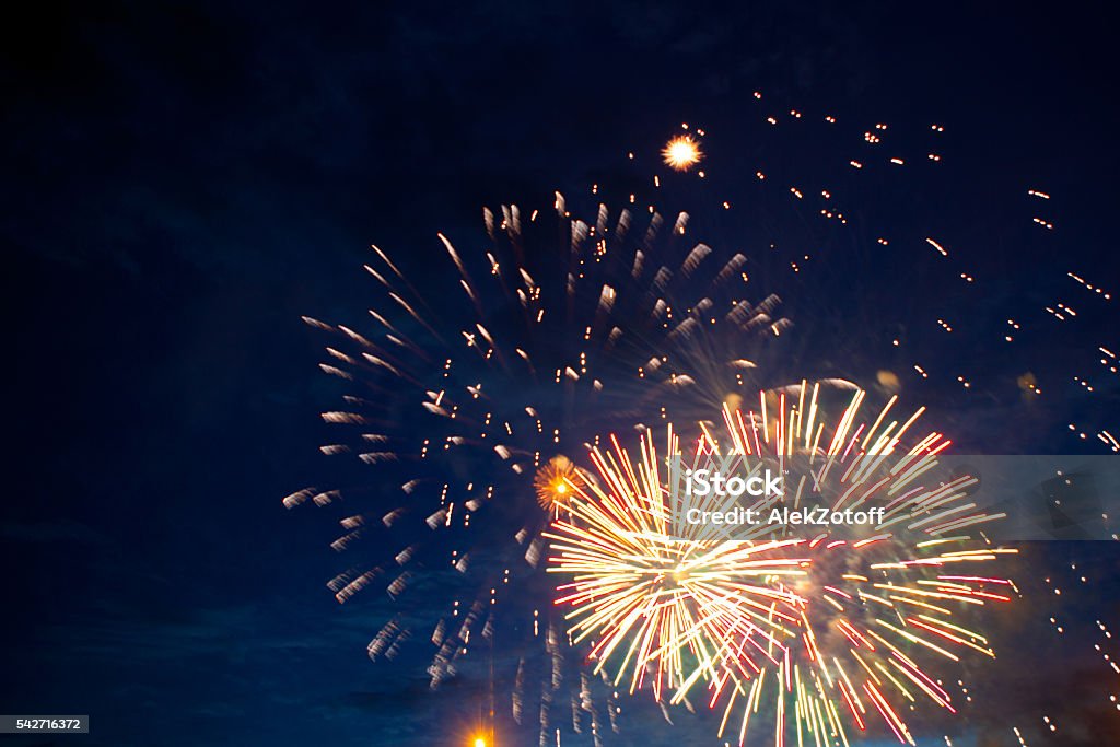 fireworks 4th July fireworks. Fireworks display on dark sky background. Firework - Explosive Material Stock Photo