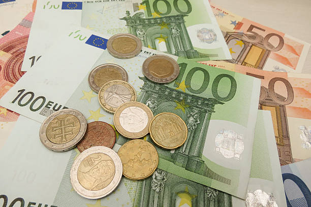 istock Euro banknotes and coins 542719088