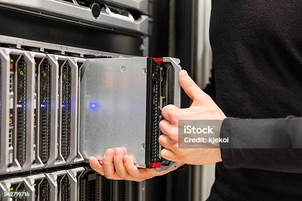 It Consultant Install Blade Server In Large Datacenter Stock Photo - Download Image Now