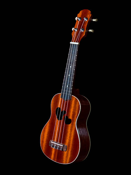 istock hawaii ukulele guitar isolated against black background, heart s 542720464