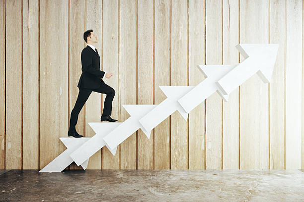 istock Man on abstract arrow ladder 542723186
