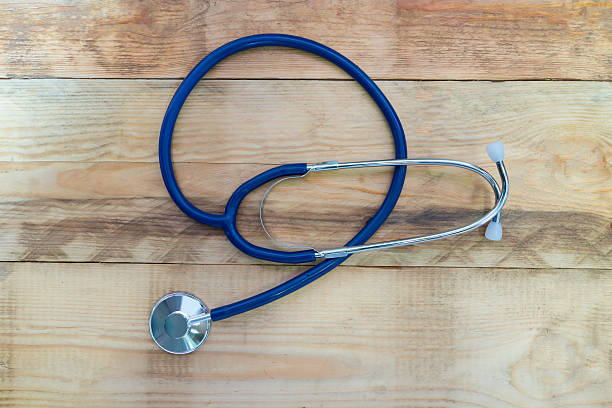 istock Medical stethoscope on wooden table. 542723824