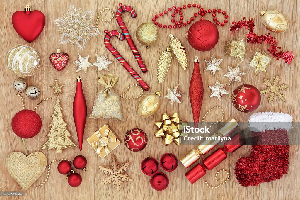 Christmas Baubles and Decorations Red and gold christmas tree baubles and decorations forming an abstract background. Christmas Cracker Stock Photo