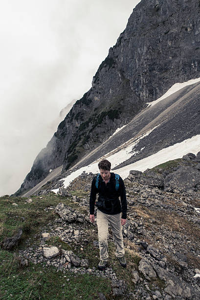 istock man hiking on the rocks 542724984