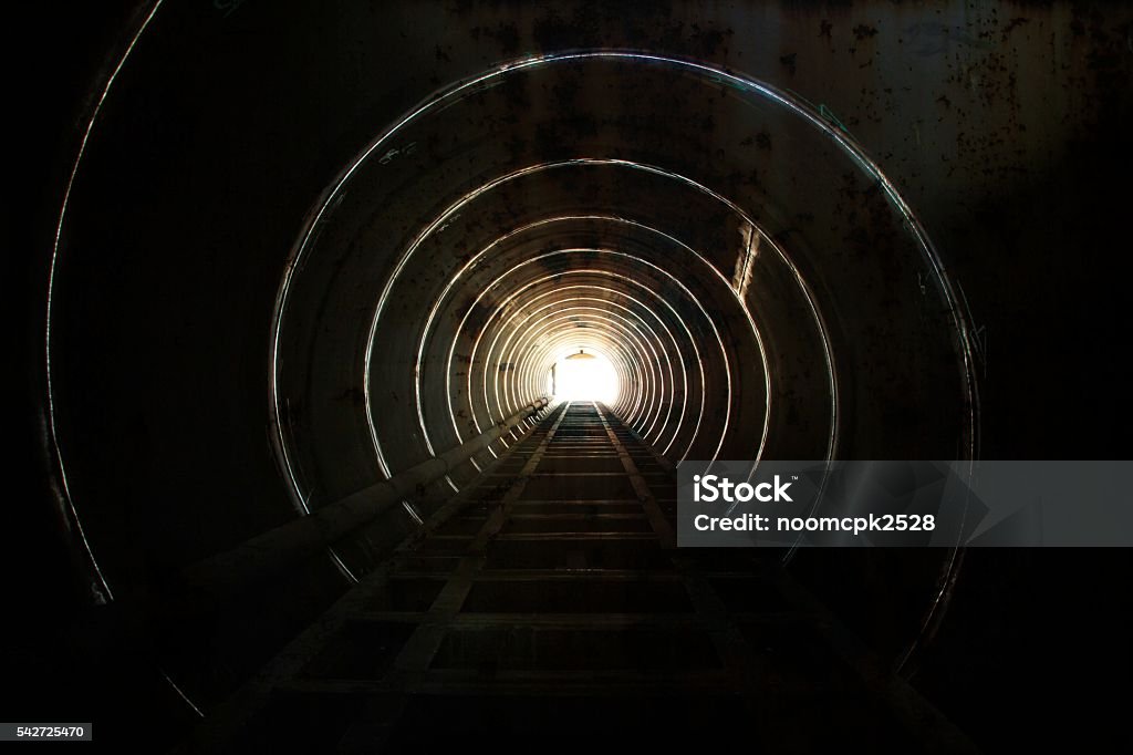 Lighting at the tunnel. Lighting at the end of the tunnel. Tunnel Stock Photo