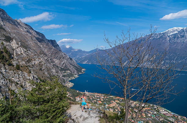 istock Woman with view on Limone sul Garda from the mountainside 542727012