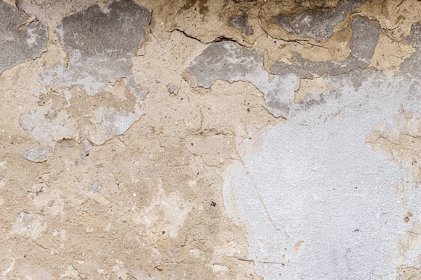 istock old house wall with cracked plaster 542727364