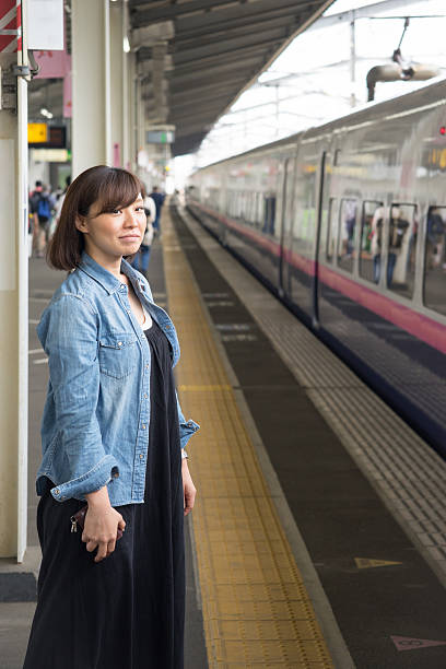 istock Women waiting for the bullet train (railway and train) 542728792