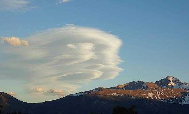 istock Cotton clouds in the blue sky with mountains 542791364