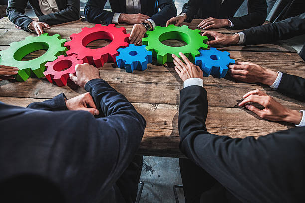 istock People with cogs of business 542791864