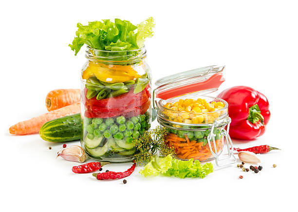 istock Colorful vegetables in glass jars 542792570