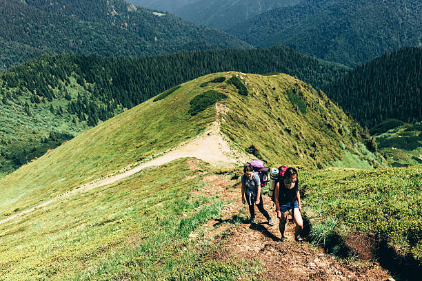 istock Girls hiking in mountains 542798318