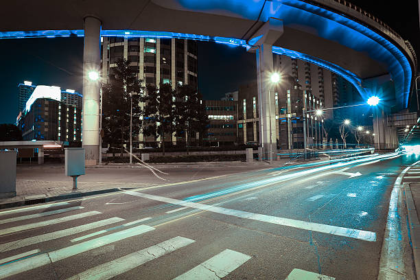 istock Empty road floor with city elevated bridge of night 542799254