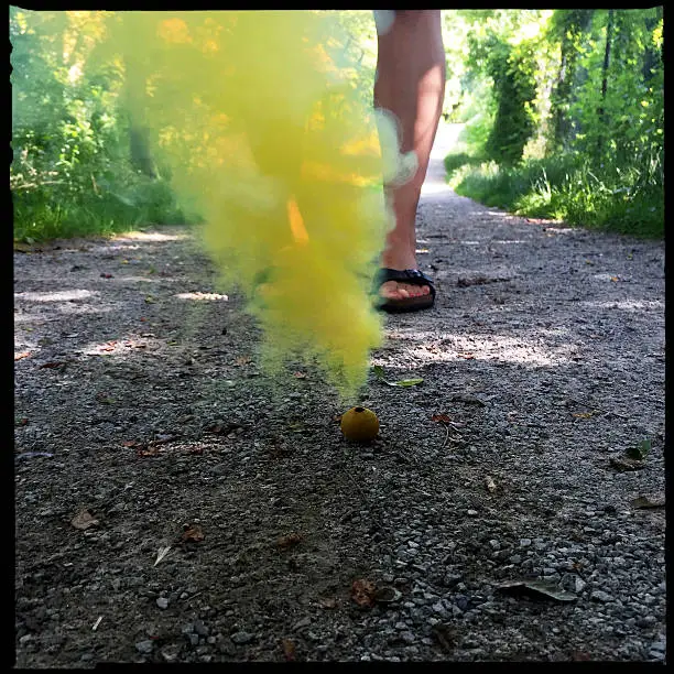 Photo of Yellow Smoke Bomb Concept