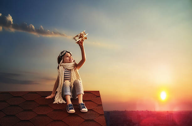 istock child playing with toy airplane 542801218