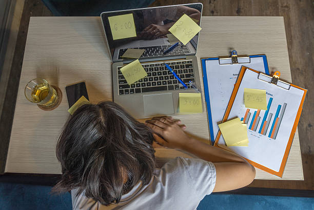 istock Close-up of exhausted employee fall asleep in the working time 542803224