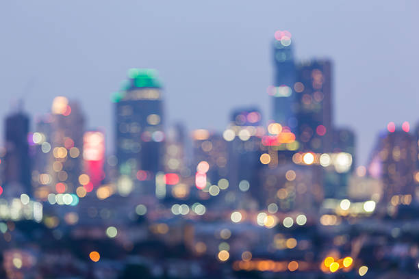istock Abstract blurred lights city office building background, night view 542803426