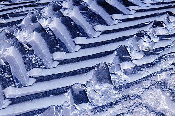 istock Tractor wheel tracks in the snow. 542803620