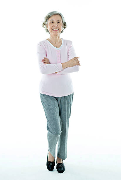 istock Attractive senior woman isolated on white background 542805478