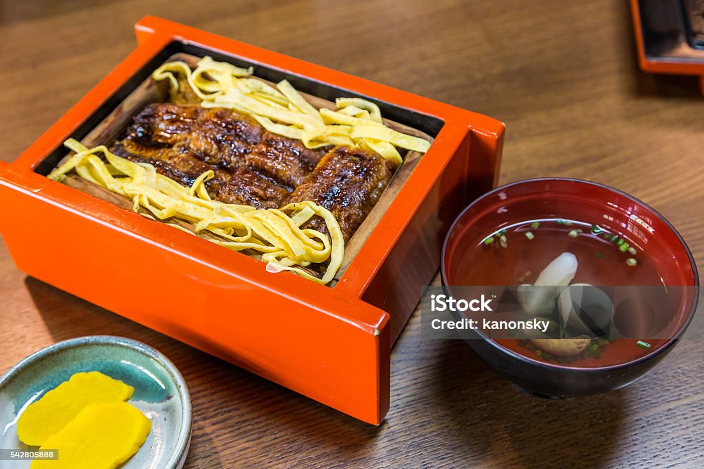 Unagi don - Grill eel rice with clear soup Unagi don - Grill eel rice in red box with clear soup Asia Stock Photo