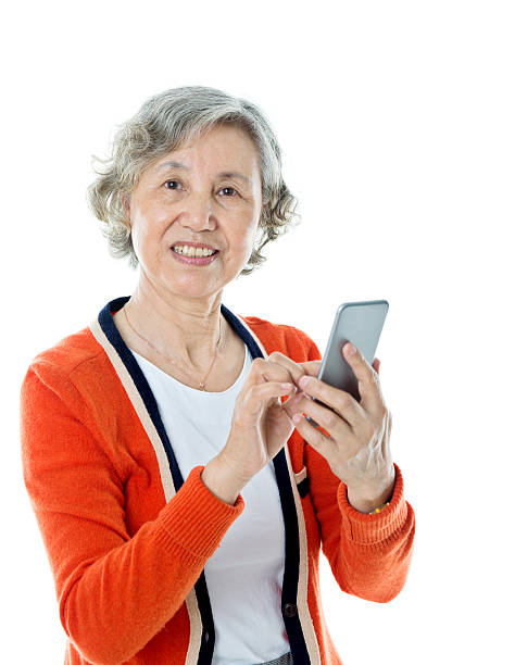 istock Asian senior woman using mobile phone 542805938