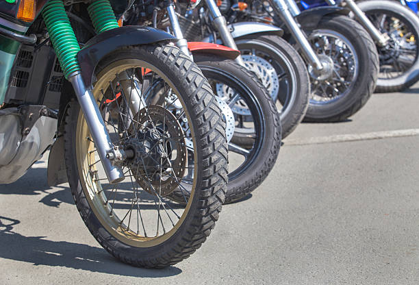 istock motorcycles on parking on asphalt  close up 542807506