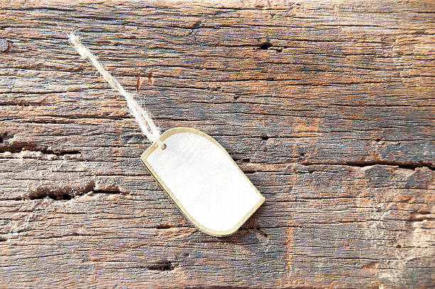 istock Tag label on old wooden texture 542808104
