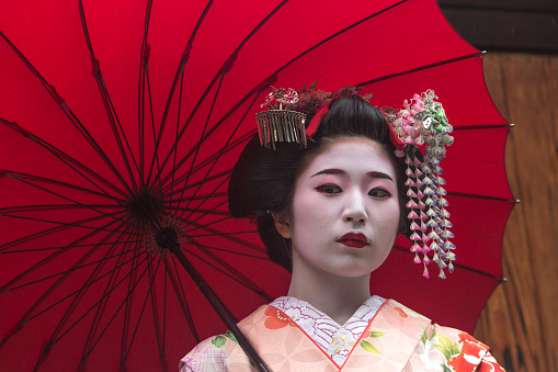 traditional geisha maiko girl at street of kyoto japan