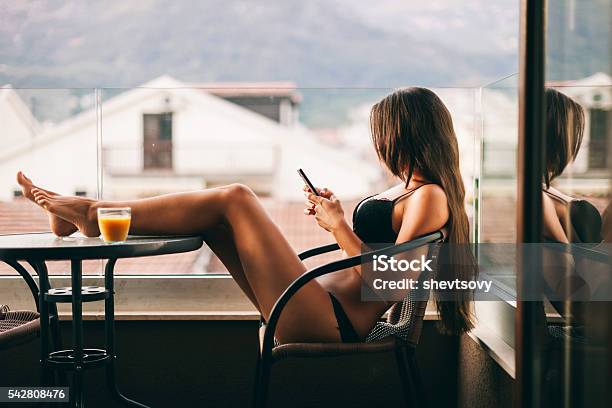 Sexy Woman Using Smartphone At Home Stock Photo - Download Image Now - Sex Symbol, Sensuality, Women