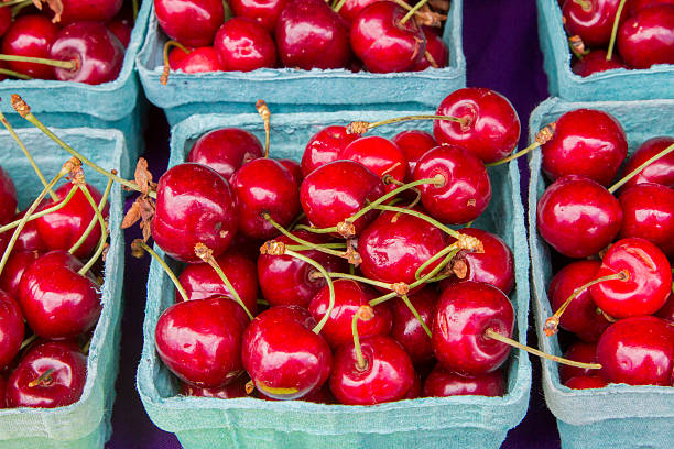 istock Boxes of sweet red cherries 542809158
