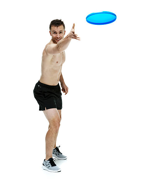 istock Shirtless muscular throwing frisbee 542811228