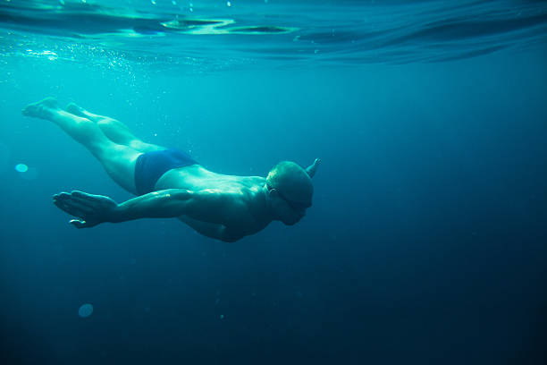 istock man swim underwater sea 542811622