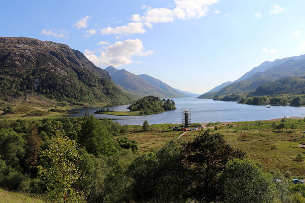 Glenfinnan Monument View of Glenfinnan Monument and Loch Schiel in Scotland - May 2016. glenfinnan monument stock pictures, royalty-free photos & images